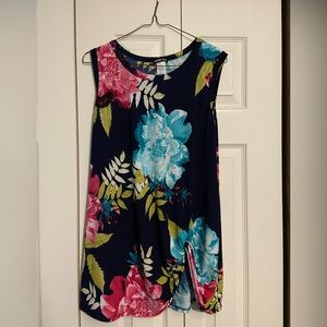 Longer style, sleeveless blouse with front knot.